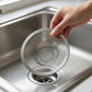 Close view of stainless steel fine mesh strainer collecting debris