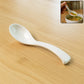 Plastic soup spoon with deep bowl and ergonomic handle in white