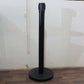 Crowd control pole with retractable belt in use at event venue