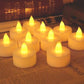 Flickering white LED tealight candle creating a warm ambiance.