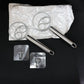 Two stainless steel spiral hand whisks placed on kitchen countertop