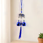 Metal evil eye wind chime hanging in home garden for protection and decor