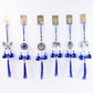 Detailed view of evil eye metal bell wind chime for house protection